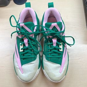 Green, pink, and cream Nike basketball shoes, Giannis Immortality.
